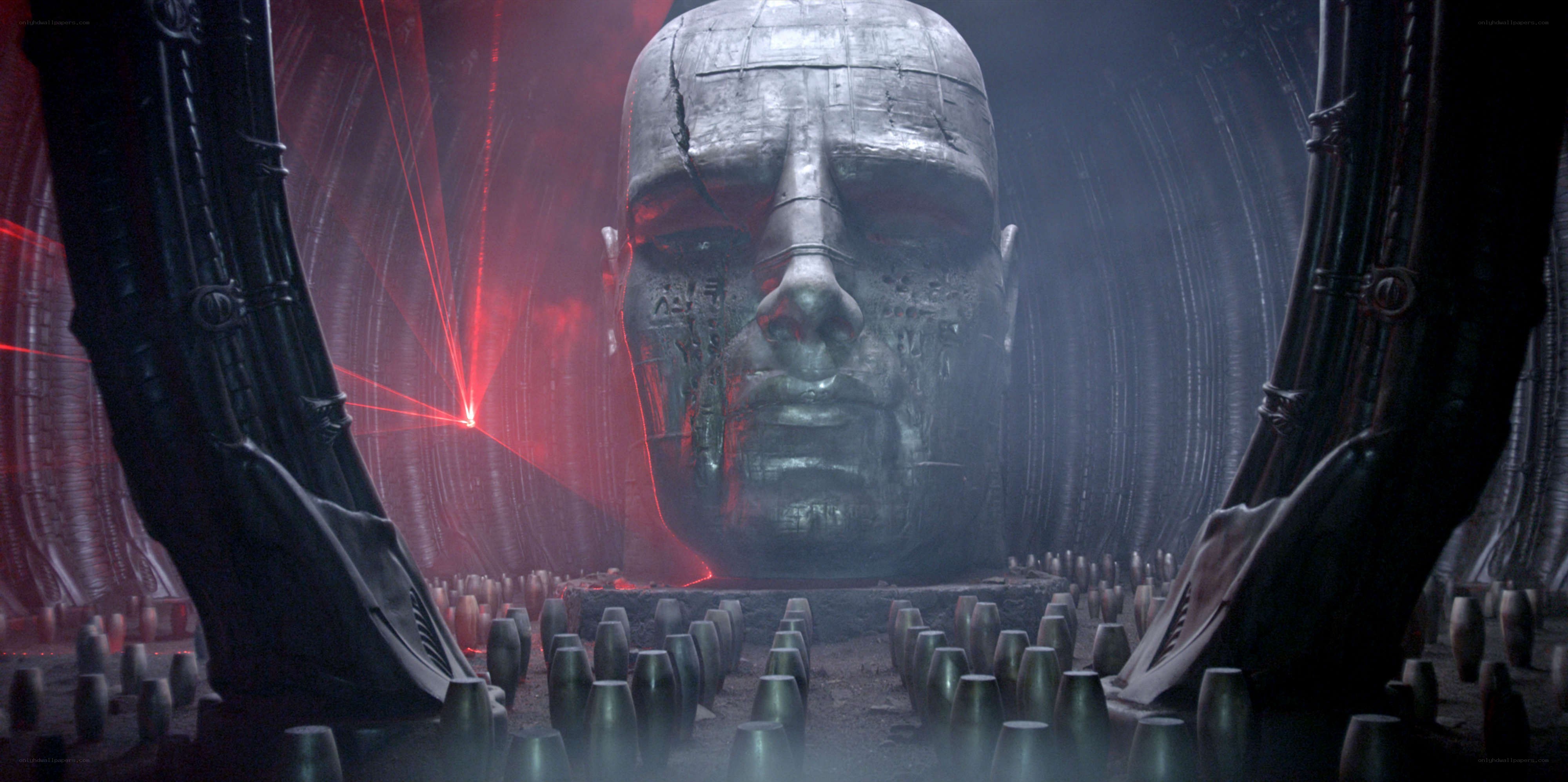 giant head in dark chamber