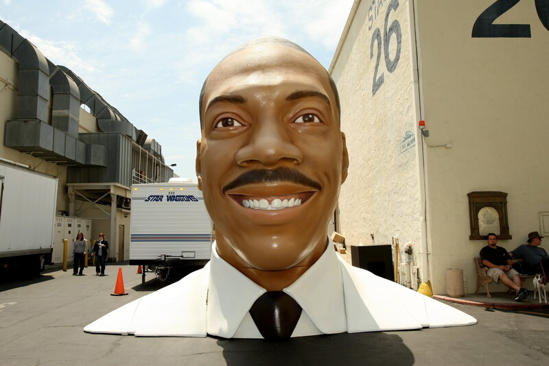 giant head sculpture of comedian
