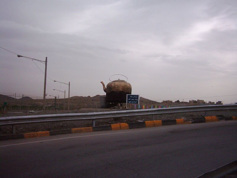 giant kettle sculpture on roadside