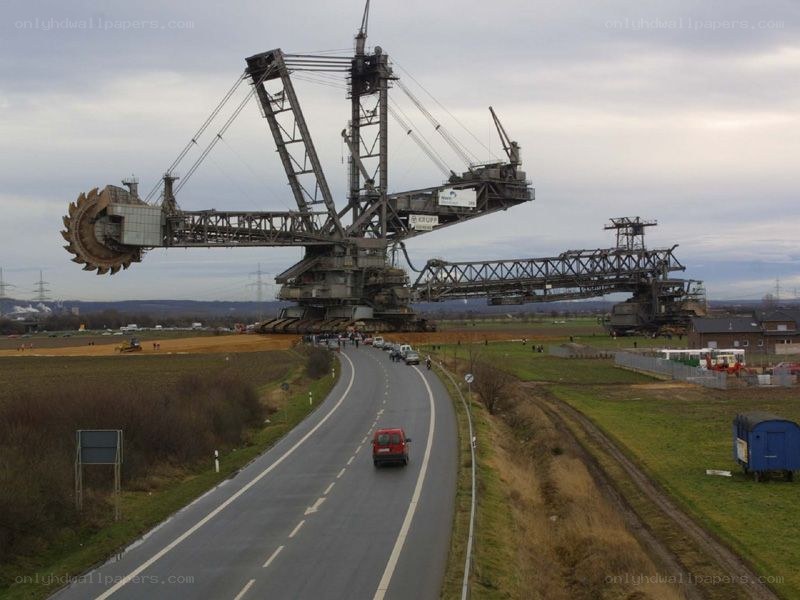 Giant mining excavator on road