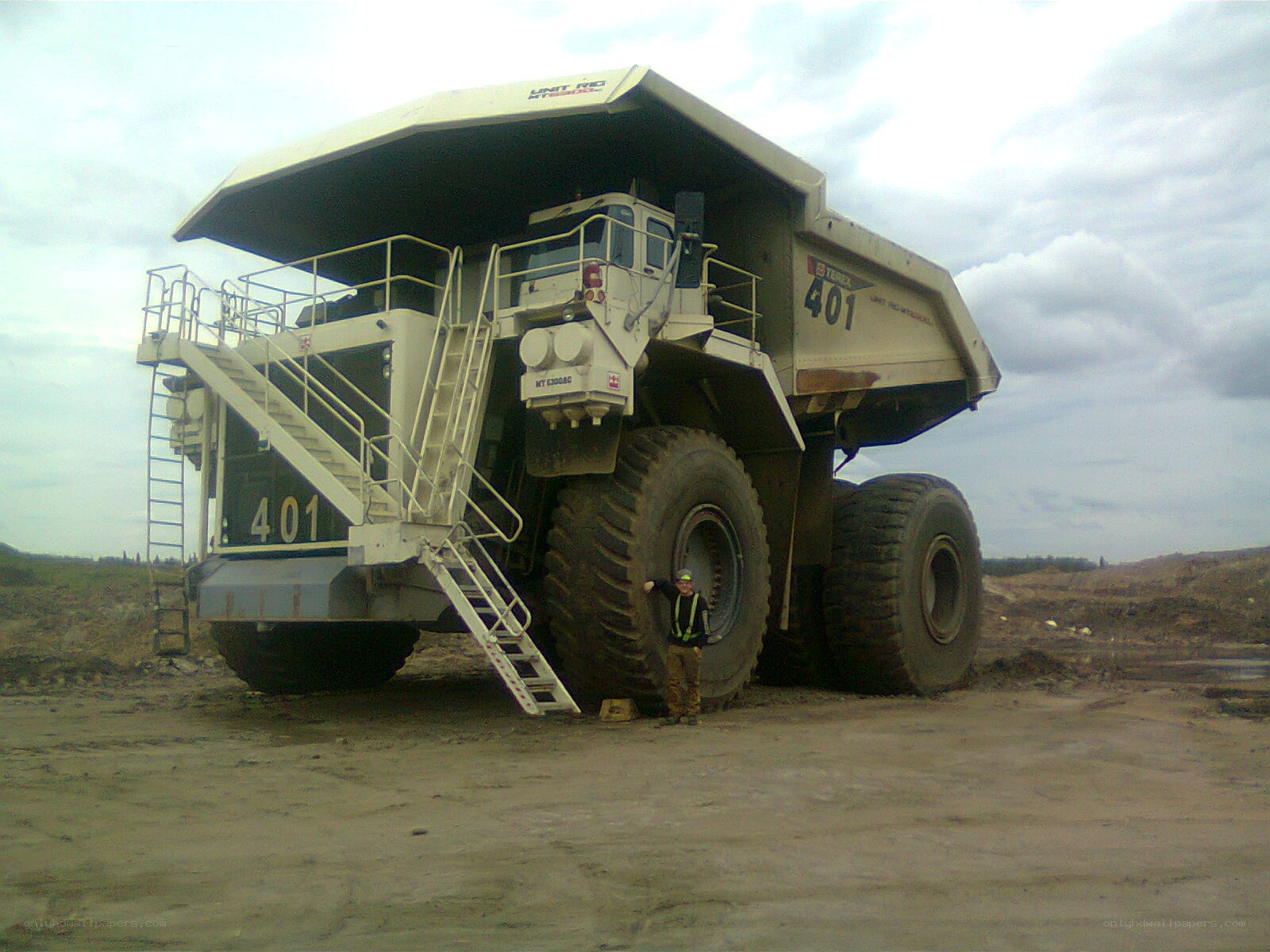giant mining truck with worker