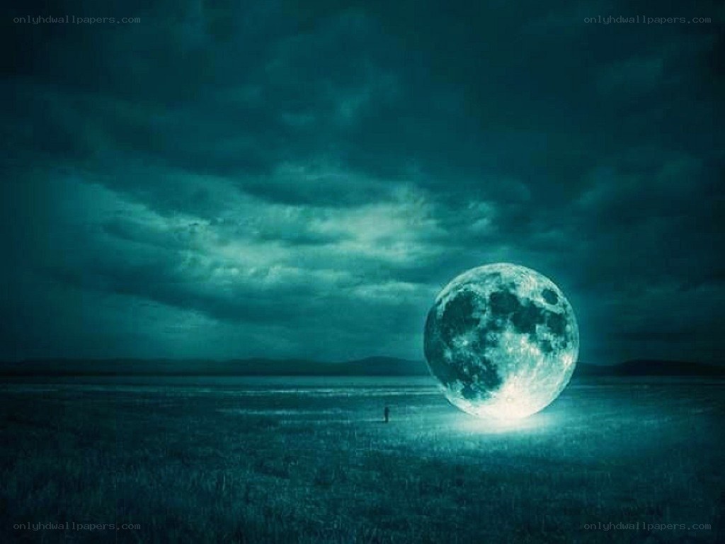 Giant moon over a field