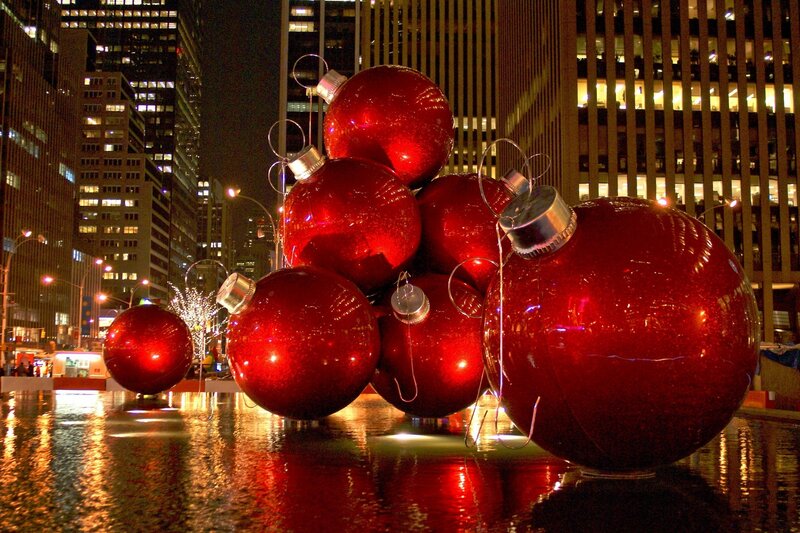 Giant red ornaments in city