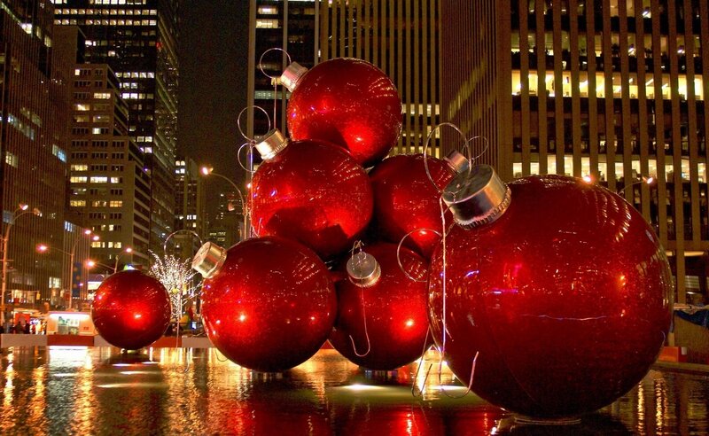 Giant red ornaments in city