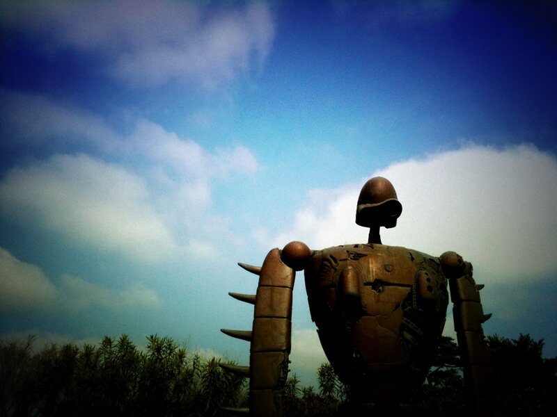 Giant robot statue under sky