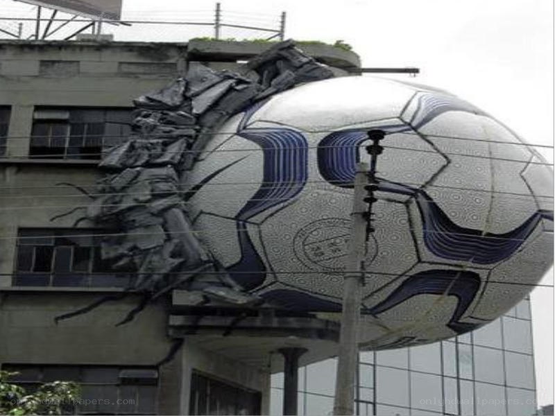 giant soccer ball crashing through building