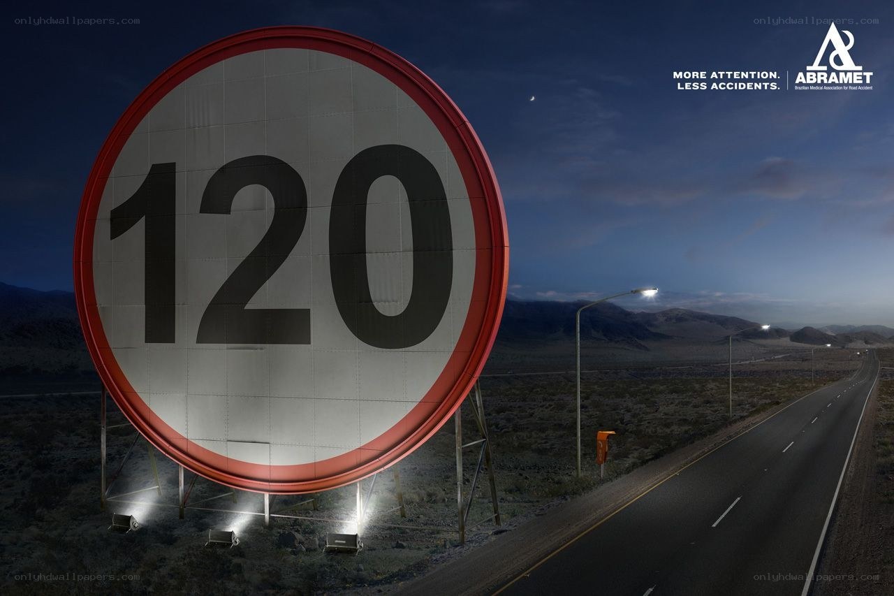 Giant speed limit sign at night