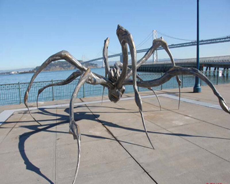 Giant spider sculpture by the water