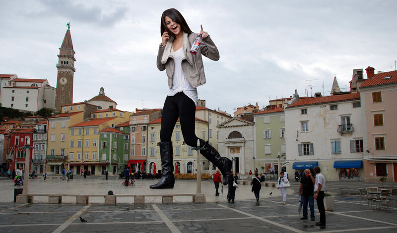 giant woman in city square