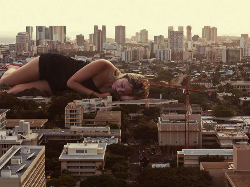 Giant Woman Lying on City