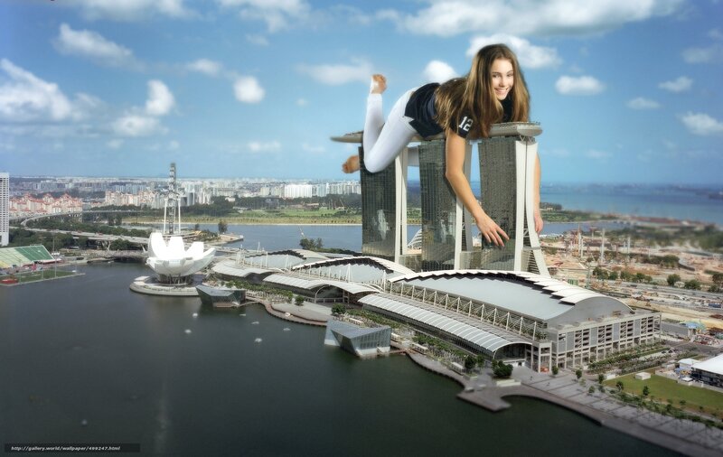 giant woman on skyscraper