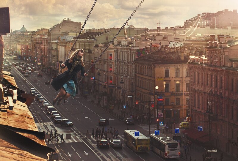 Giant woman on swing over city