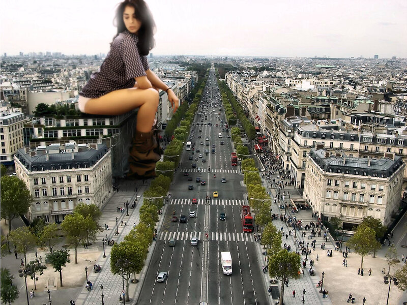 giant woman overlooking city