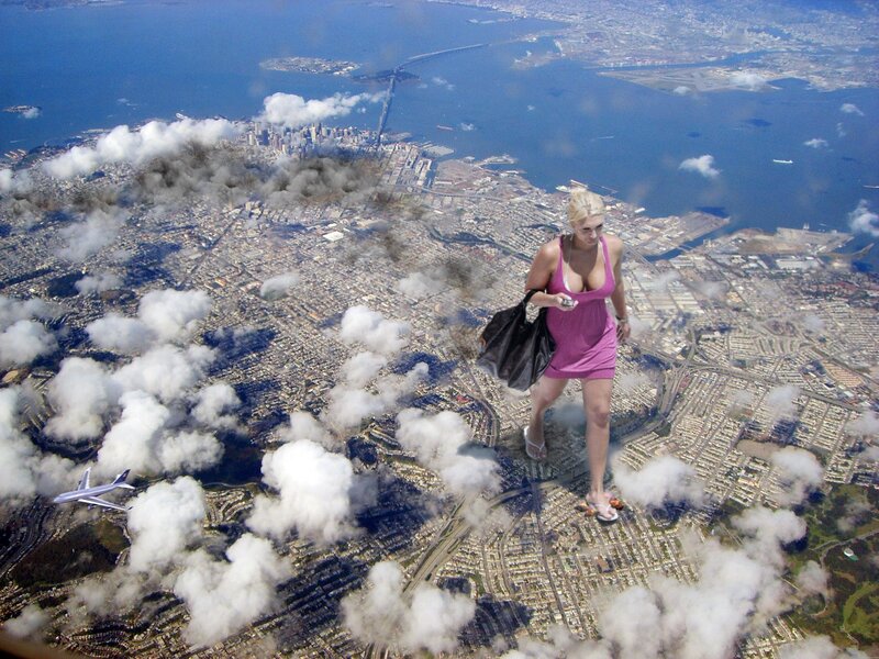 giant woman walking over city
