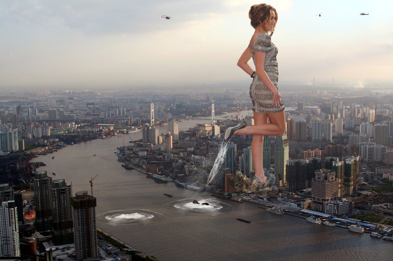 giant woman walking through city