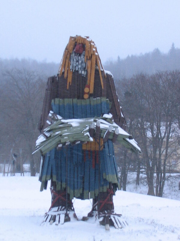 giant wooden sculpture in snow