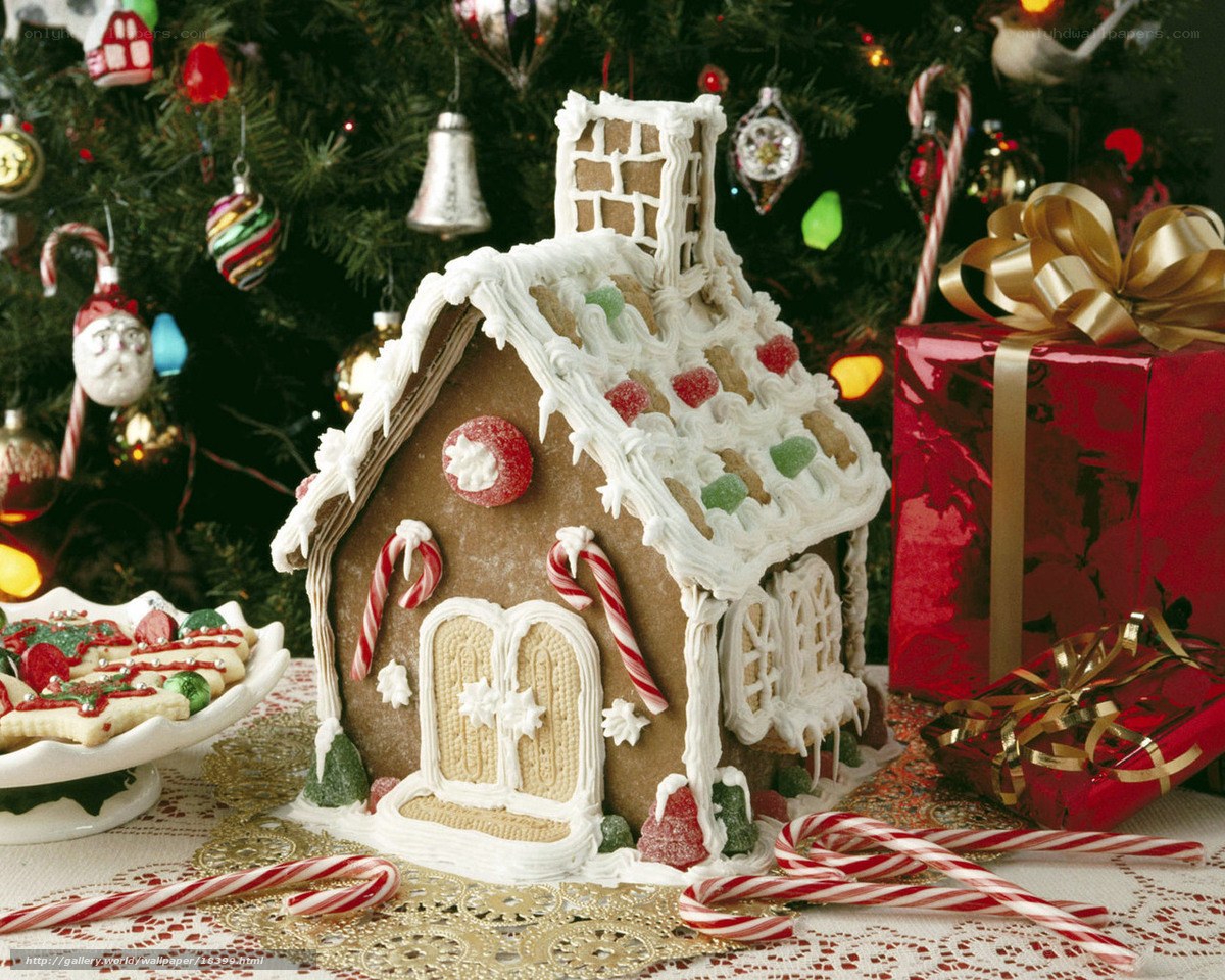 Gingerbread house by Christmas tree