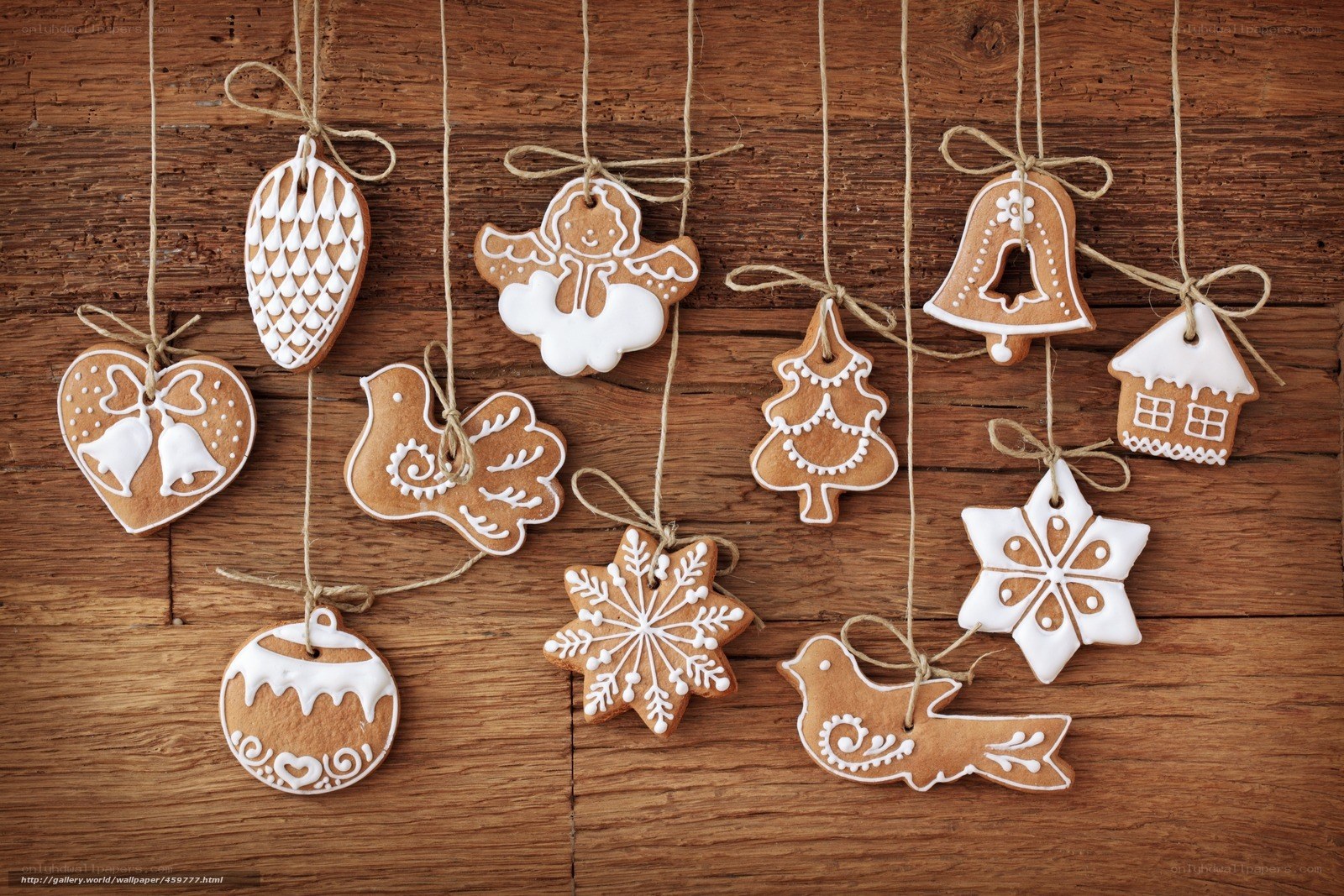 Gingerbread ornaments hanging on wood