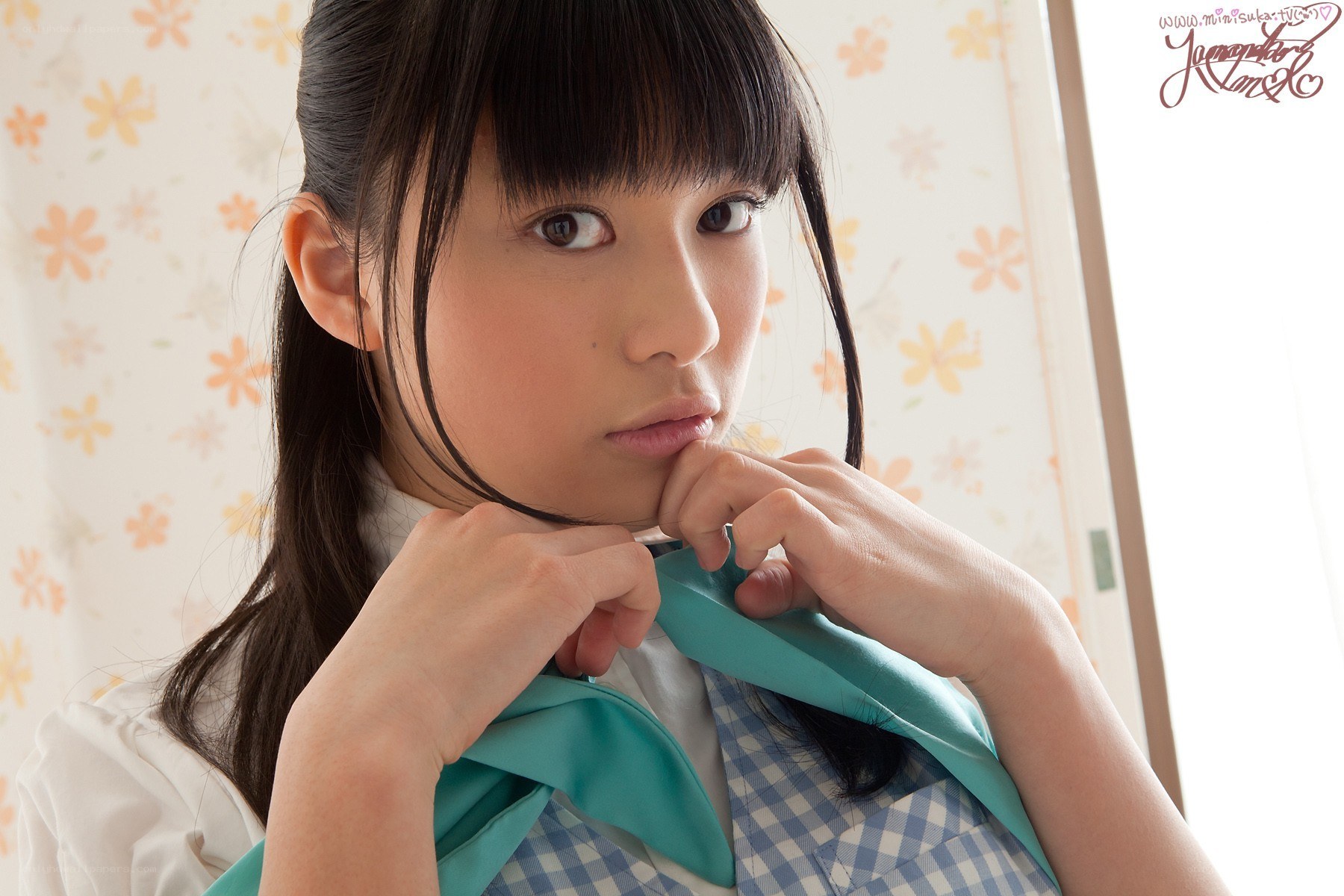 girl adjusting her school uniform