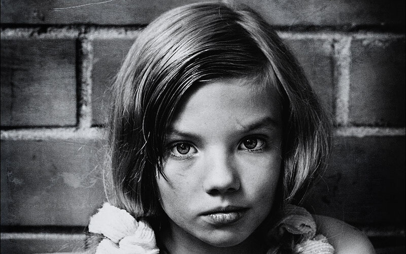 girl against brick wall