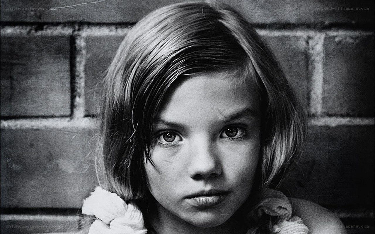 girl against brick wall