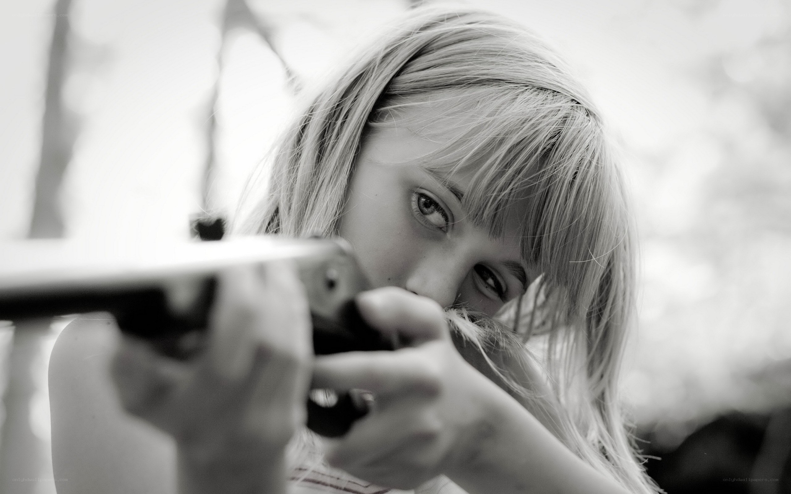 girl aiming a rifle