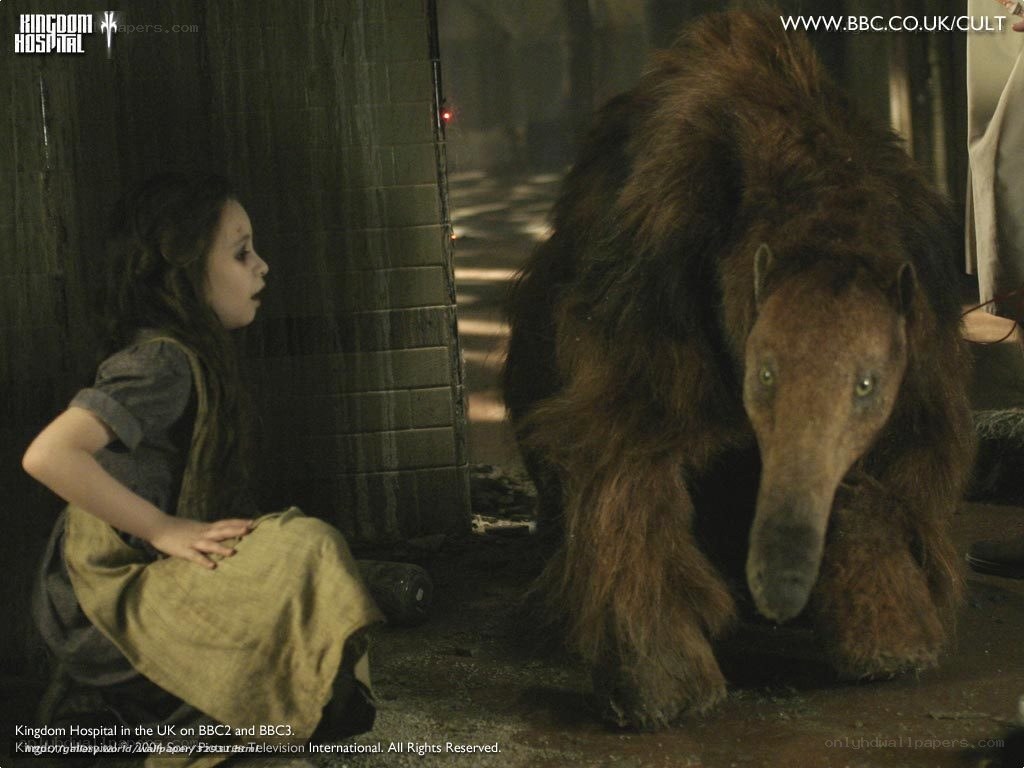 girl and creature in dark corridor