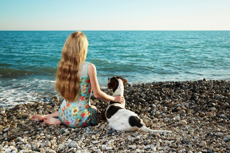 Girl and Dog on Beach