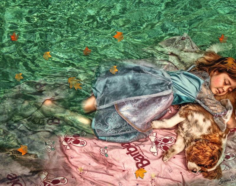 Girl and dog sleeping in water
