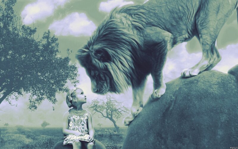 girl and lion on a hill