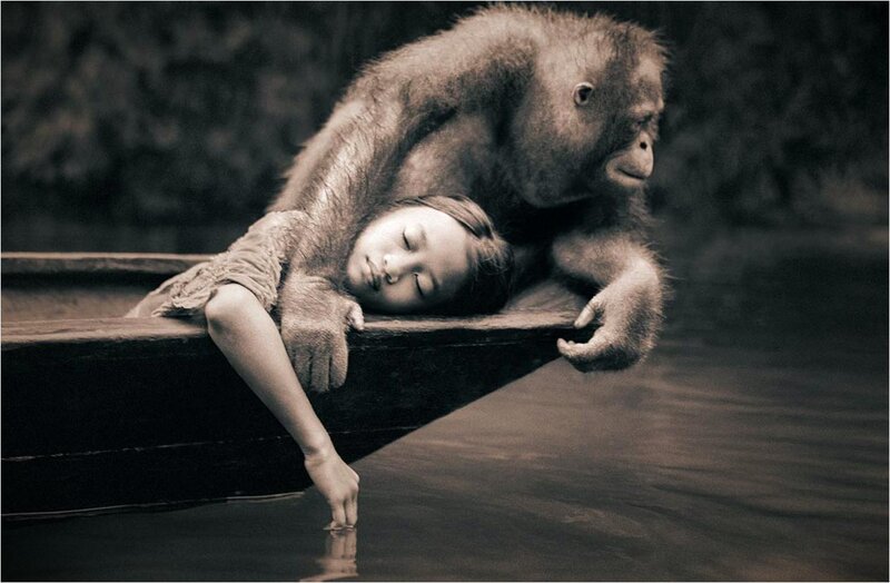 Girl and Orangutan in Boat