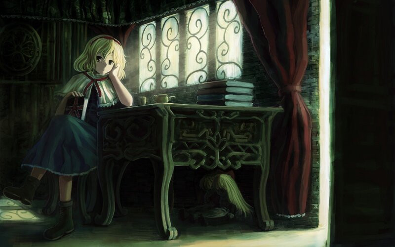 girl at a desk in a dim room