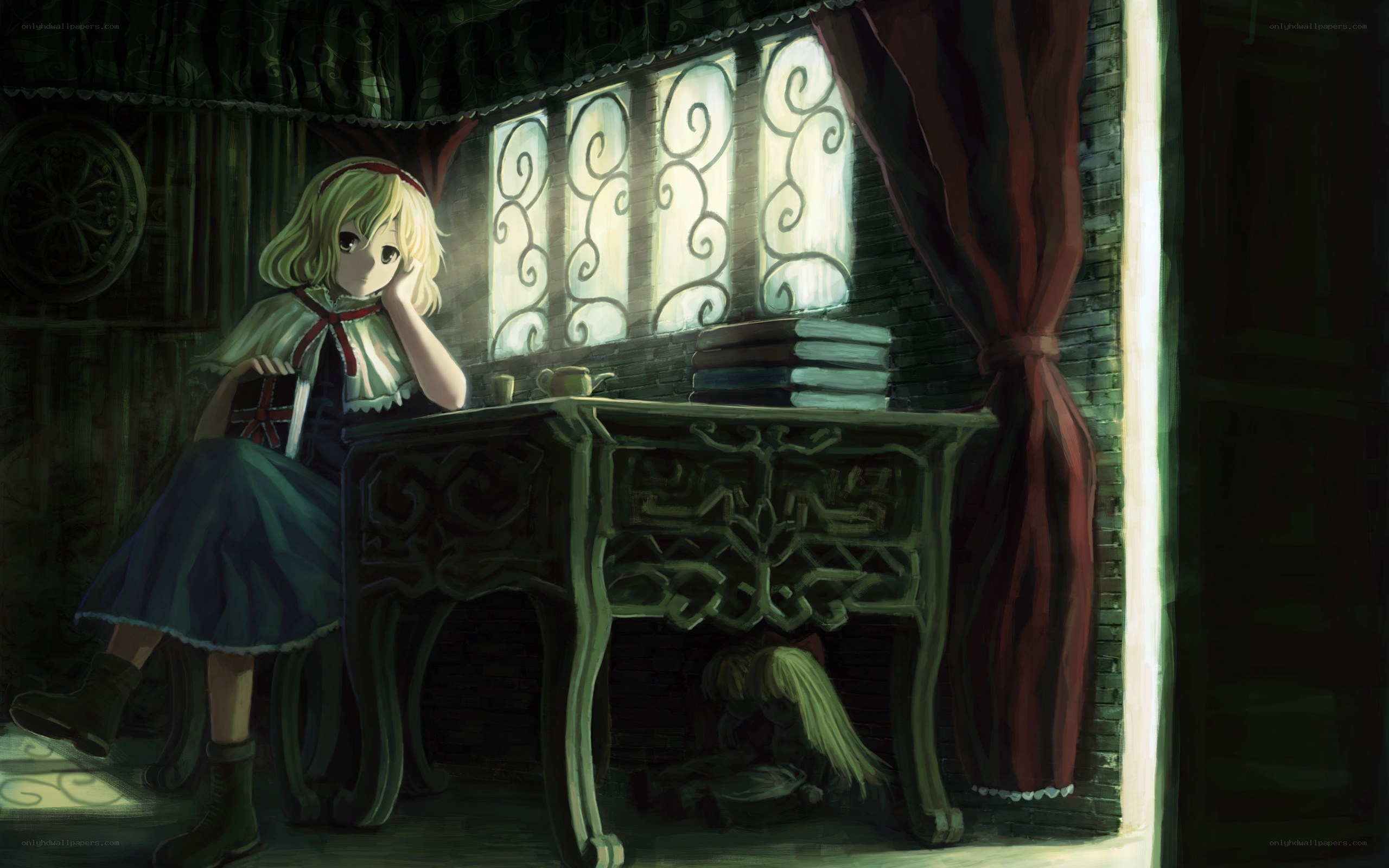 girl at a desk in a dim room