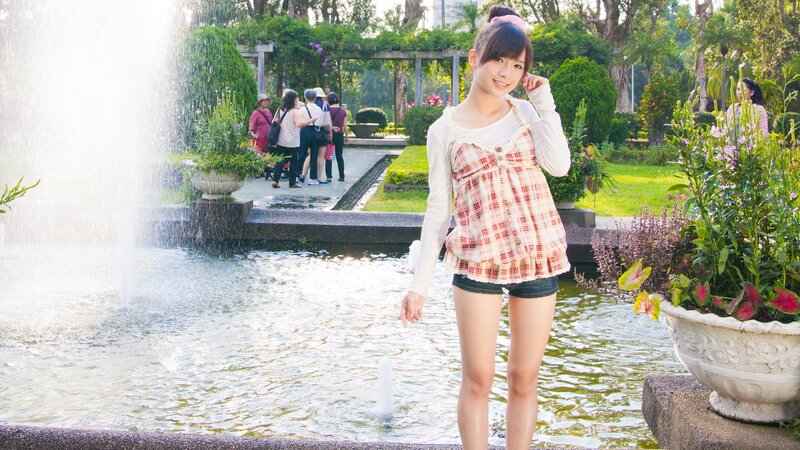 Girl at a park fountain