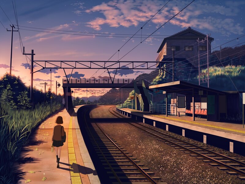 Girl at a train station at dusk