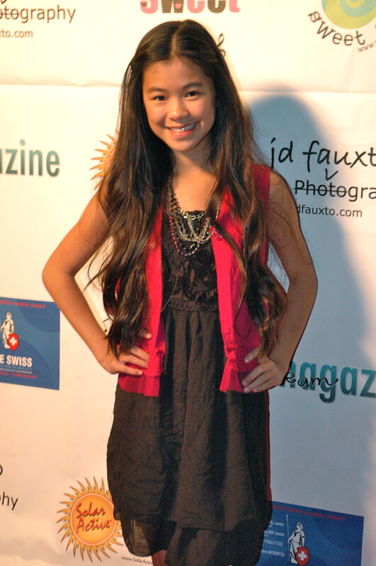 girl at event with backdrop