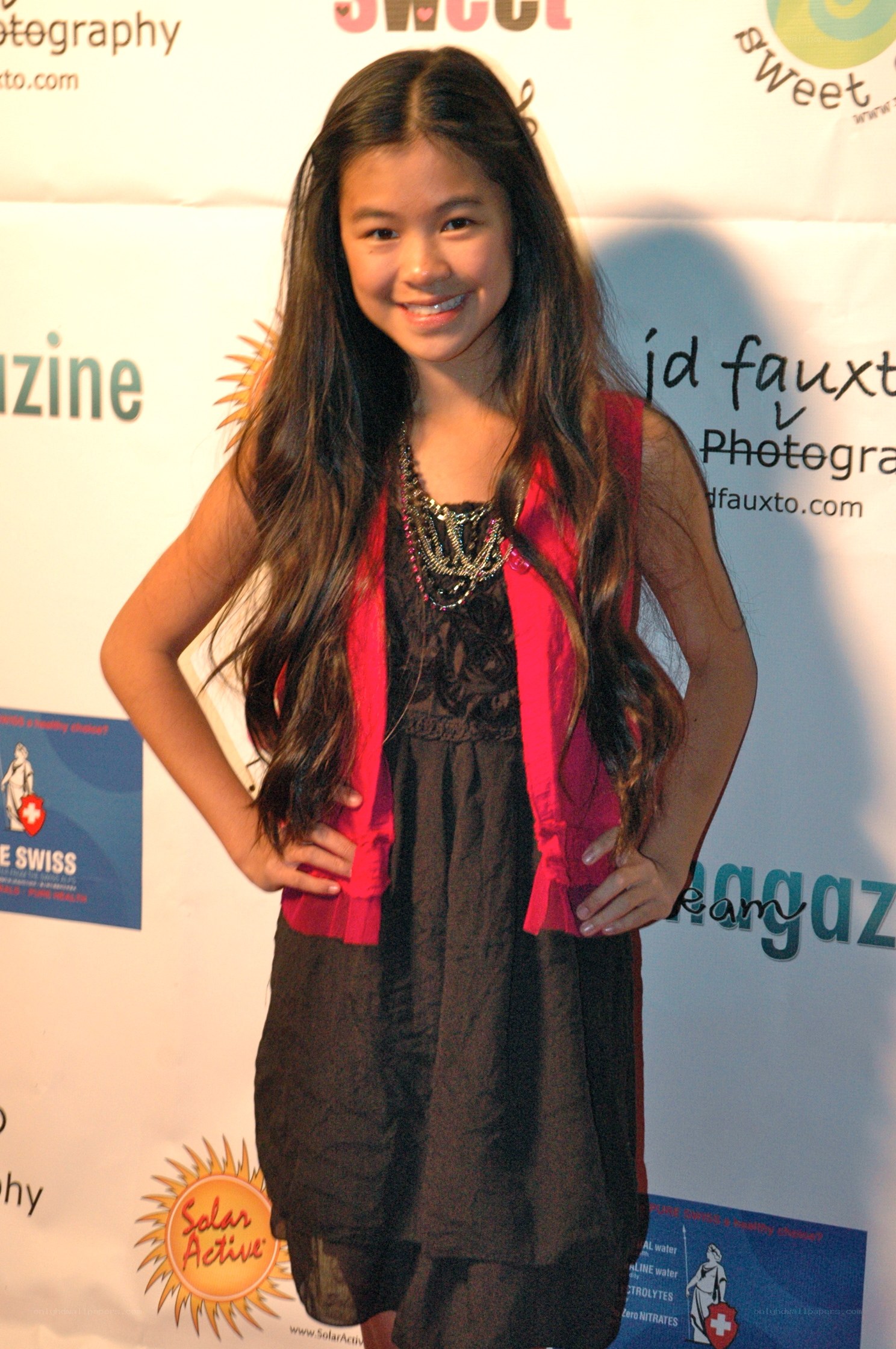 girl at event with backdrop
