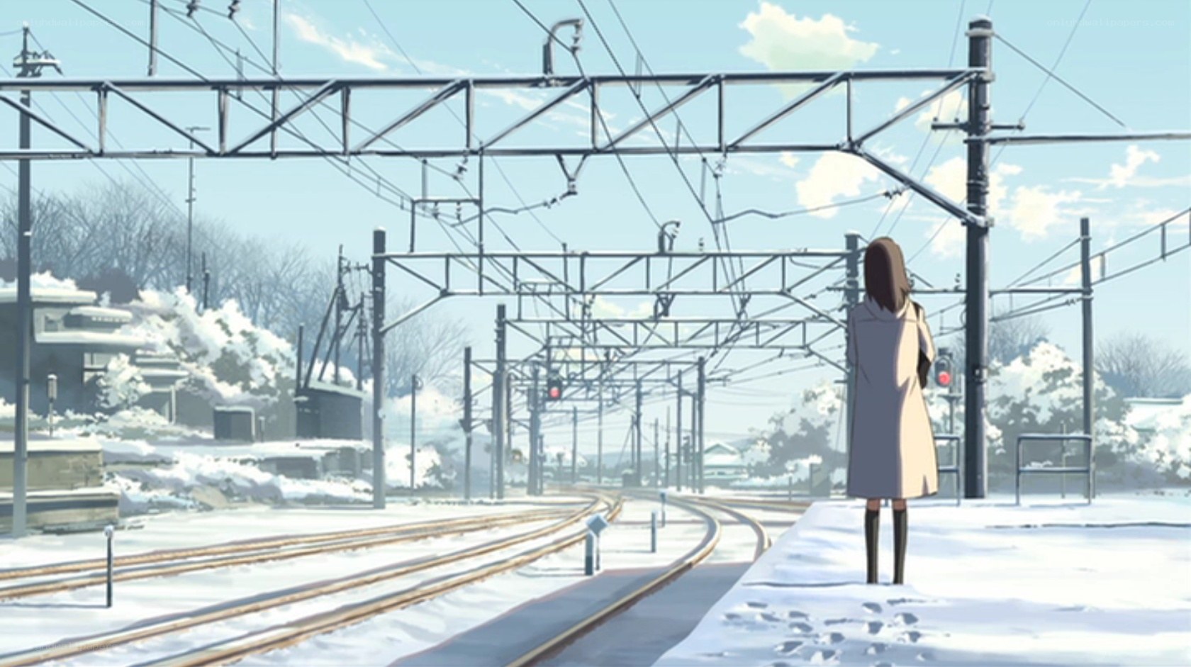 girl at snowy train station