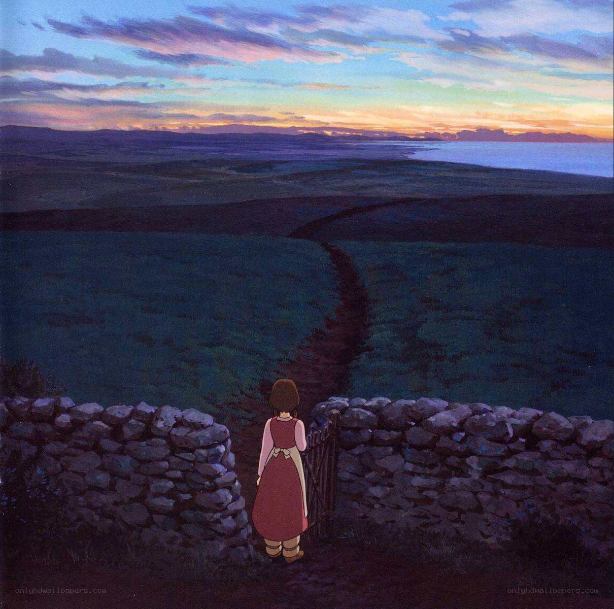 Girl at the gate overlooking a valley