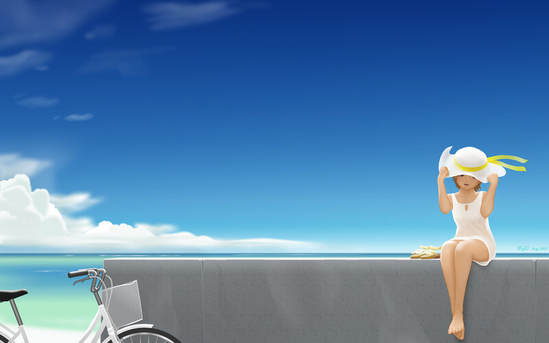 Girl at the seaside with bike