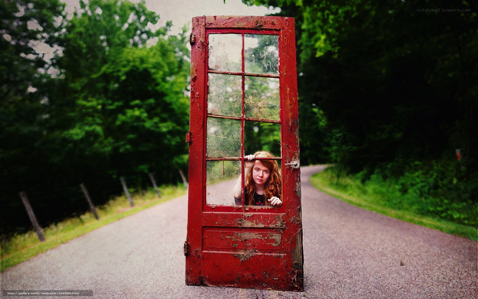 Girl behind a red door