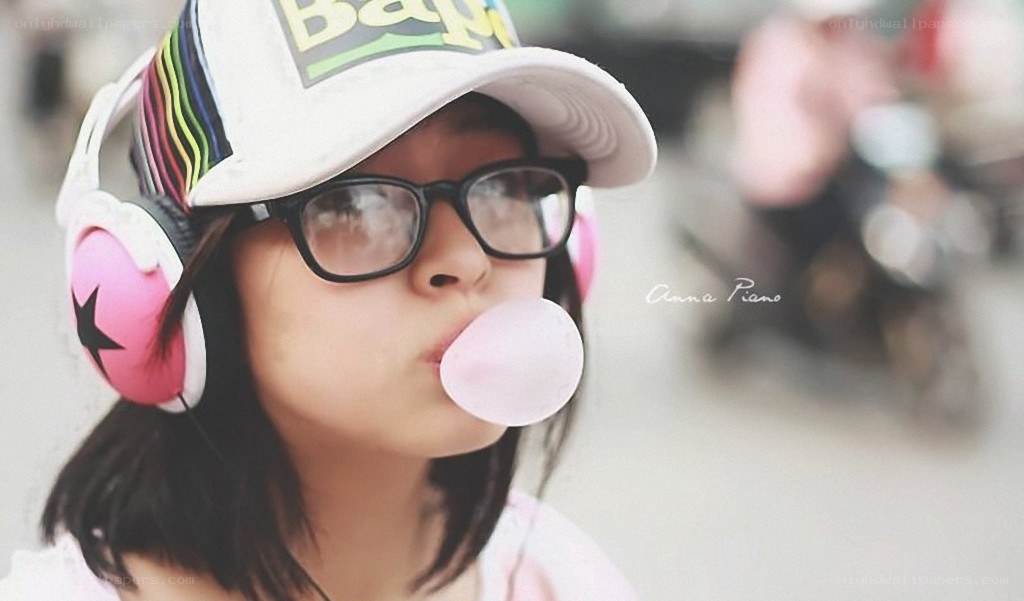 girl blowing bubble gum