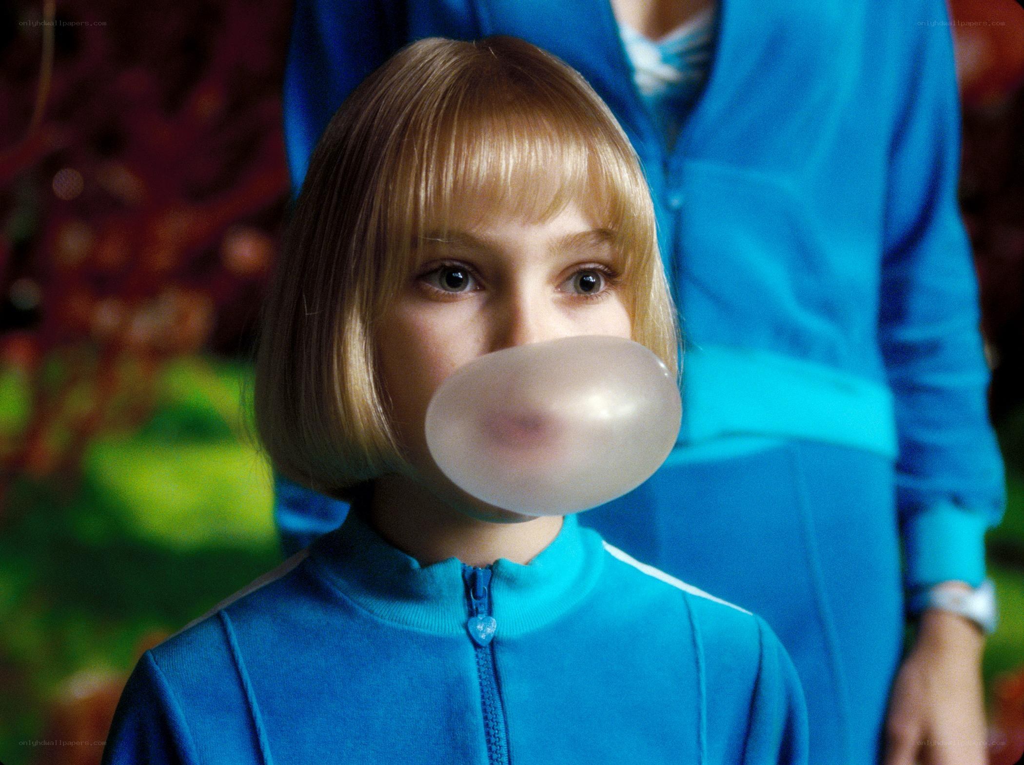 girl blowing bubble gum