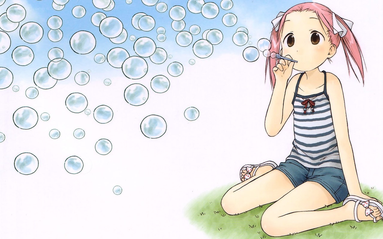 girl blowing bubbles