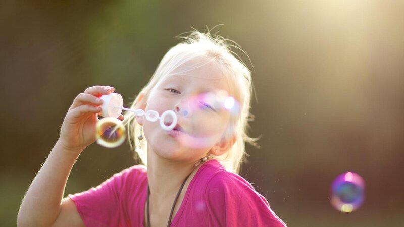 Girl Blowing Bubbles — Pink