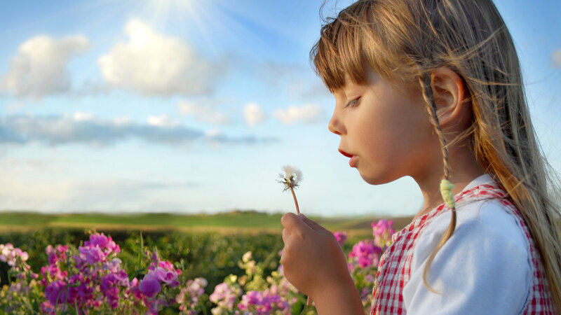 Girl Blowing Dandelion — Blue, Serene, Afternoon