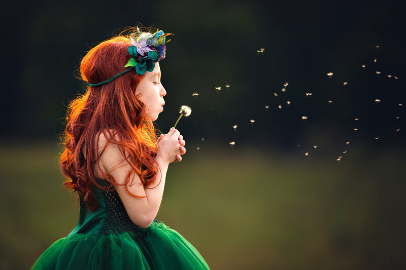 Girl Blowing Dandelion — Green, Serene, Sunset