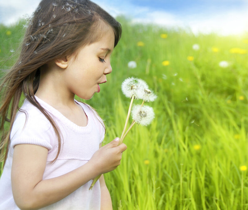 Girl Blowing Dandelion — Green, Serene