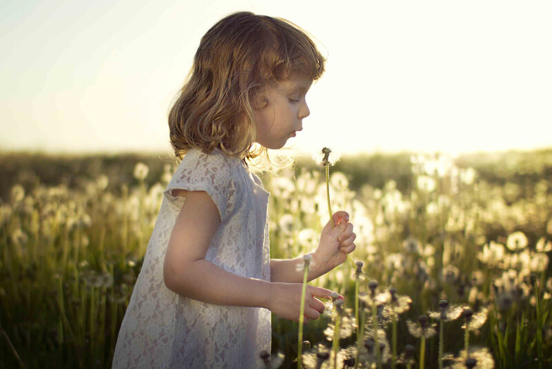 Girl Blowing Dandelion — White