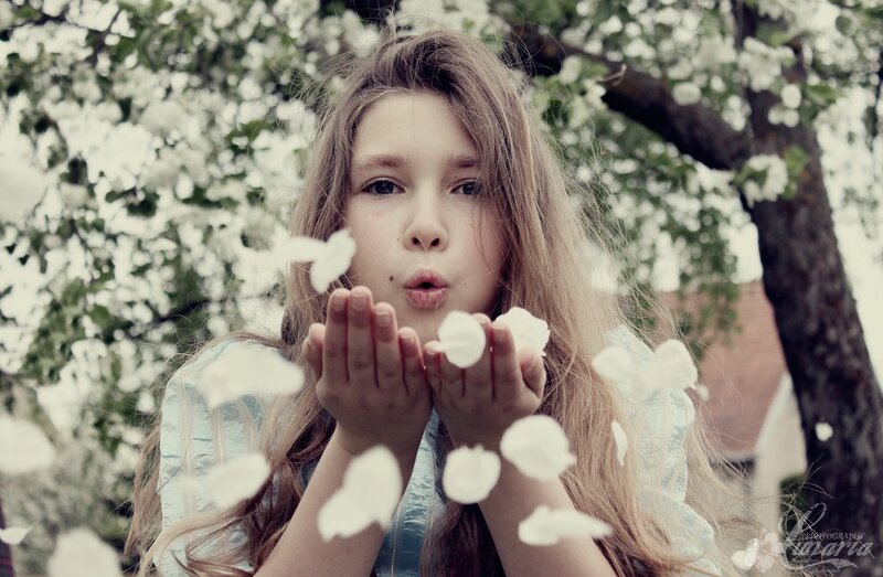 Girl Blowing Flower Petals — White